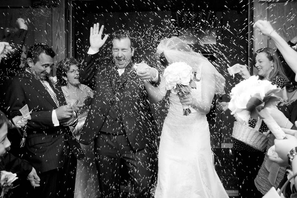 Rice being thrown on couple
