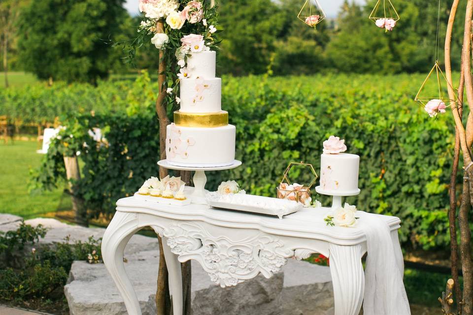 Wedding cake with dessert table