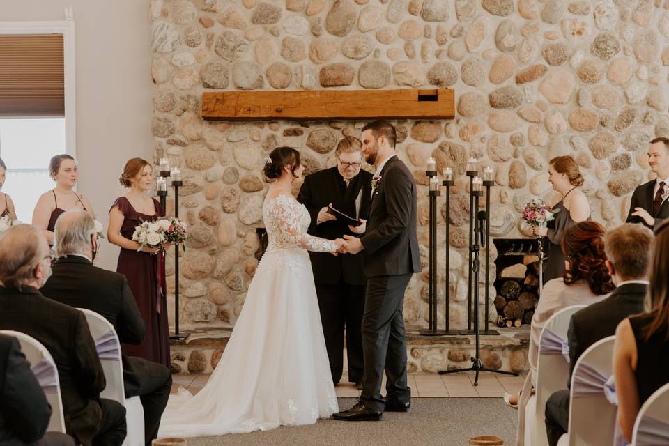 Indoor ceremony at fireplace