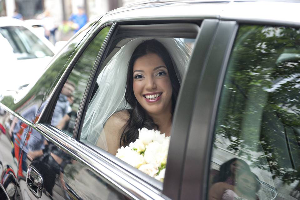 Excited bride in limo