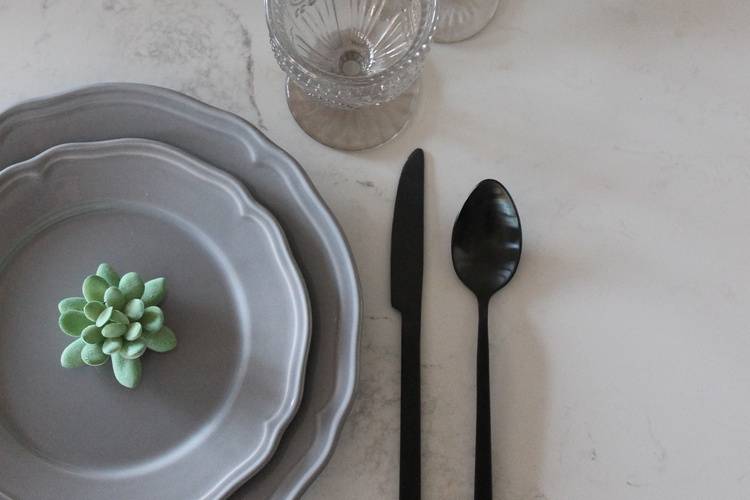 Grey plate matte black cutlery