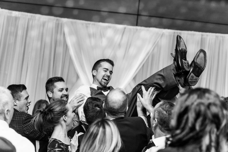 Crowd surfing with the groom