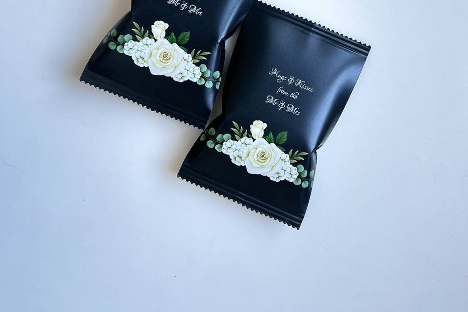 Black pouch with wedding details