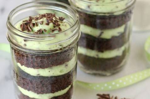 Mason jar with chocolate cake and mint cream and sprinkles