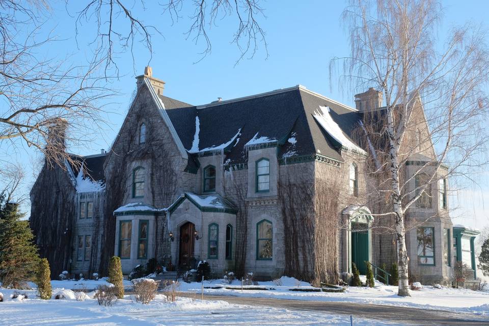 Seated in front of the mansion