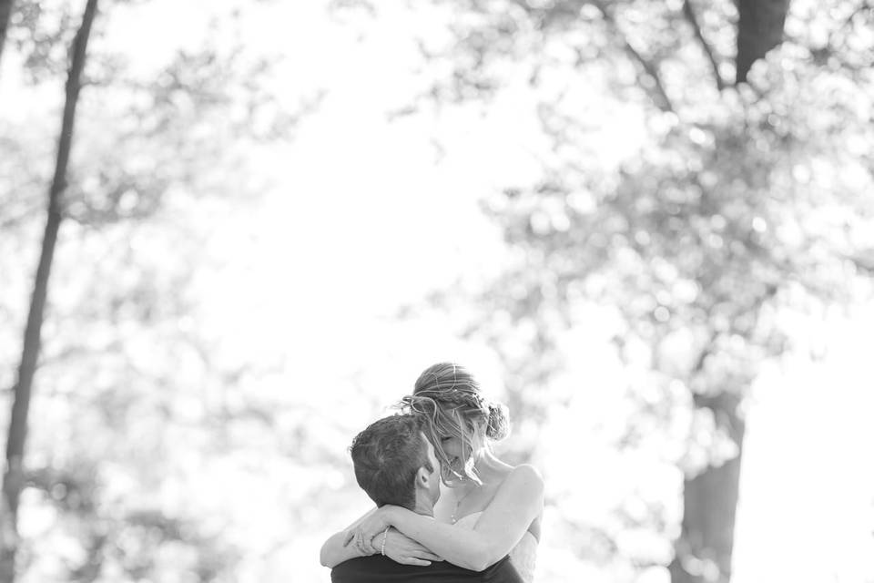 Groom holding bride