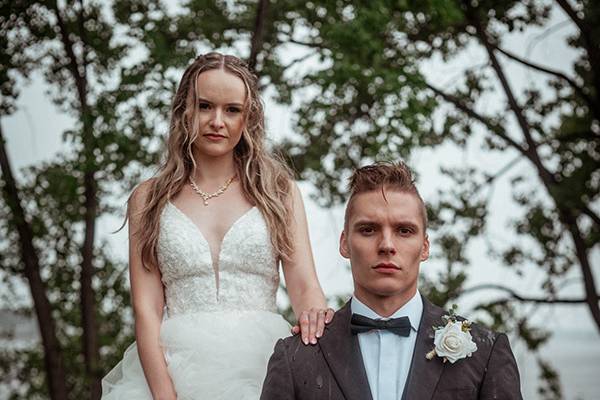 Newlyweds in the rain