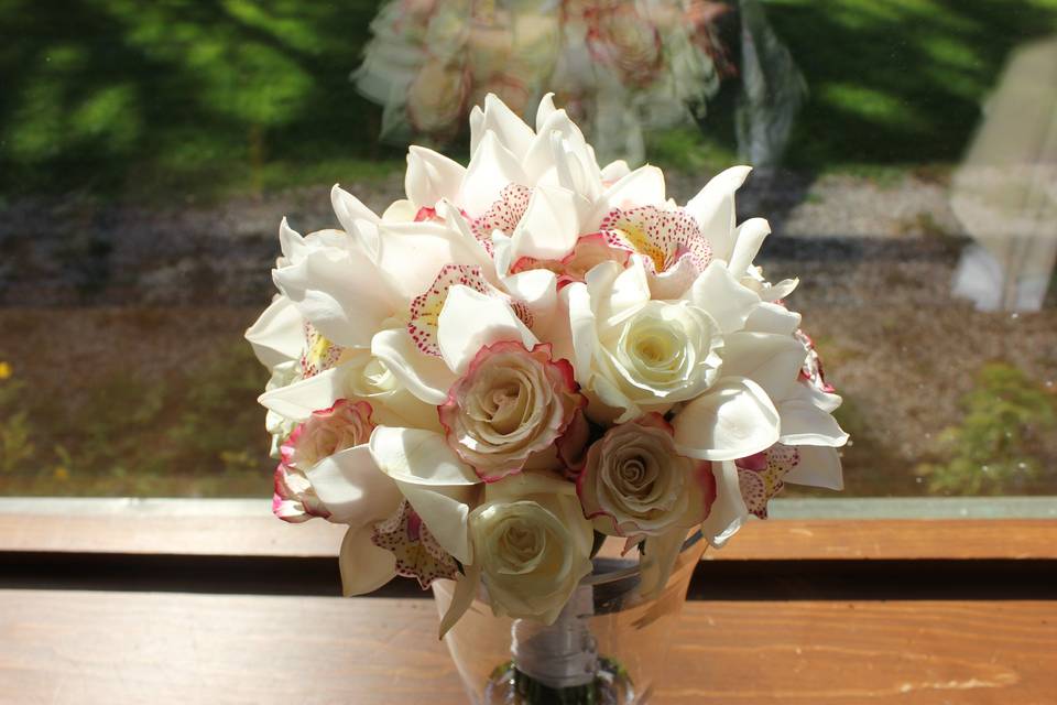 Cymbidium and roses bouquet