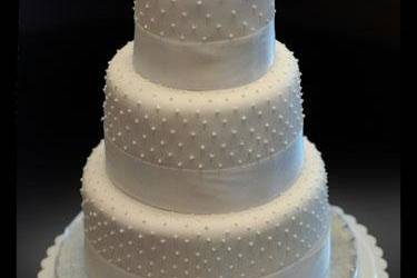 1240414982625-WhiteRosesWeddingCake.jpg