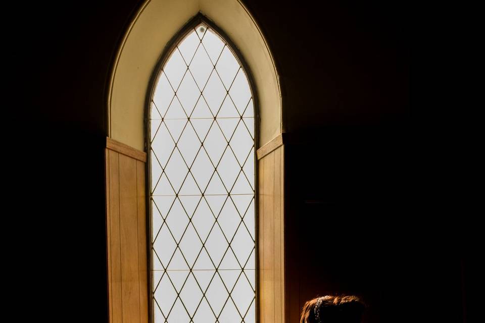Bride silhouette church window