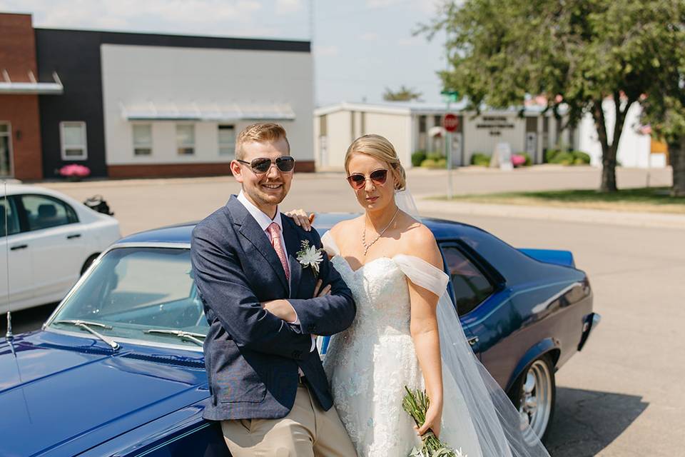 Classic car wedding couple