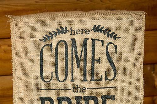 9719a-i_natural-burlap-ceremony-sign-black-print-here-comes-the-bride.jpg