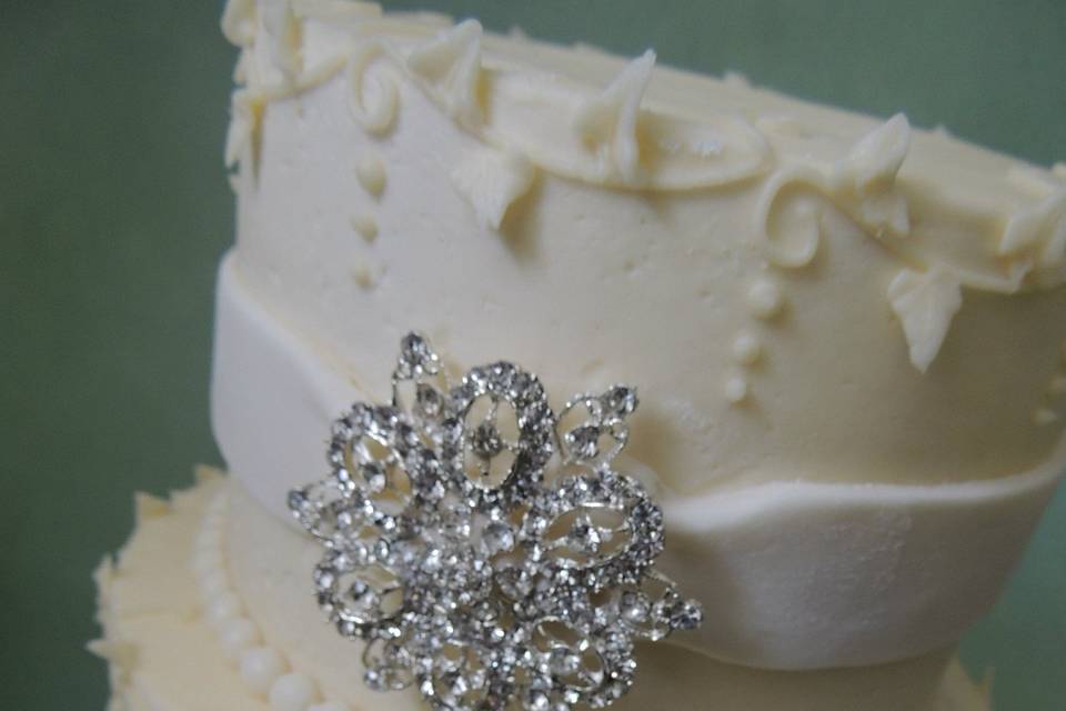 Cake embellished with brooches