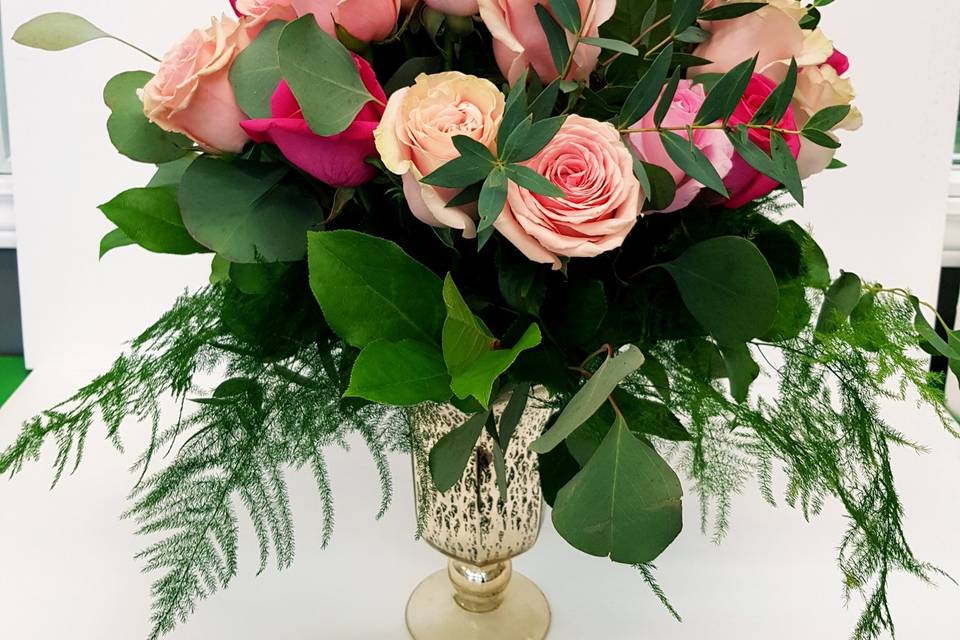 Gold vase pink roses