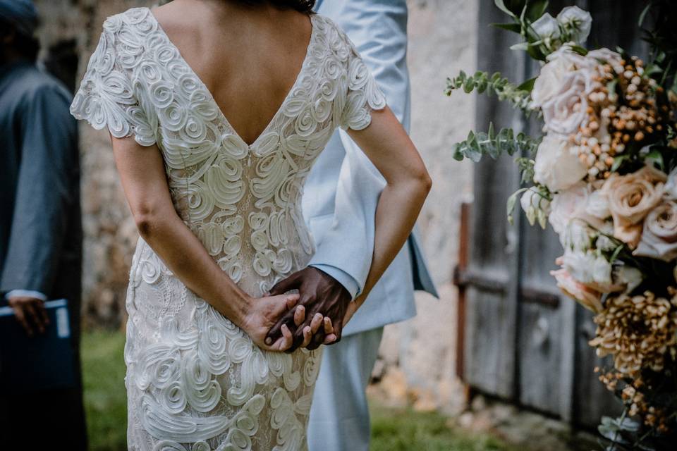 Bride and groom holding hands