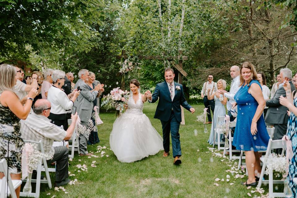 Bride and groom exiting ceremo