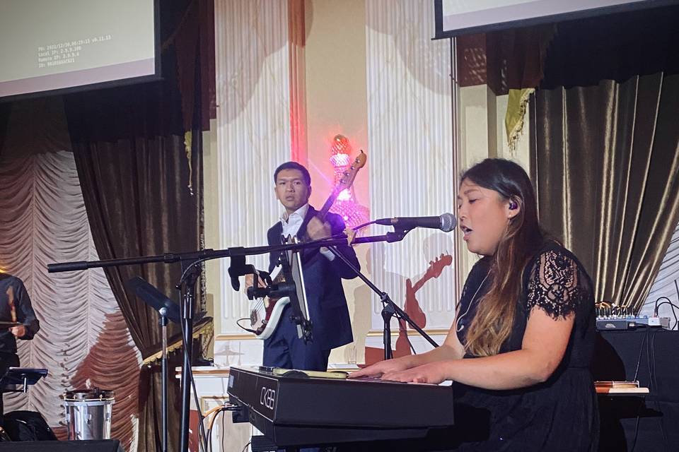 Alaina on the keys and mic