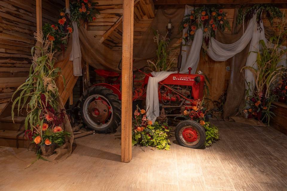 Old red sits inside the barn.