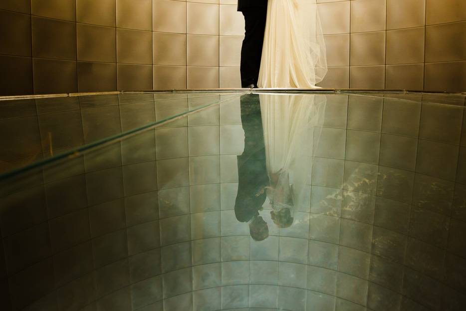 Bride and groom reflection