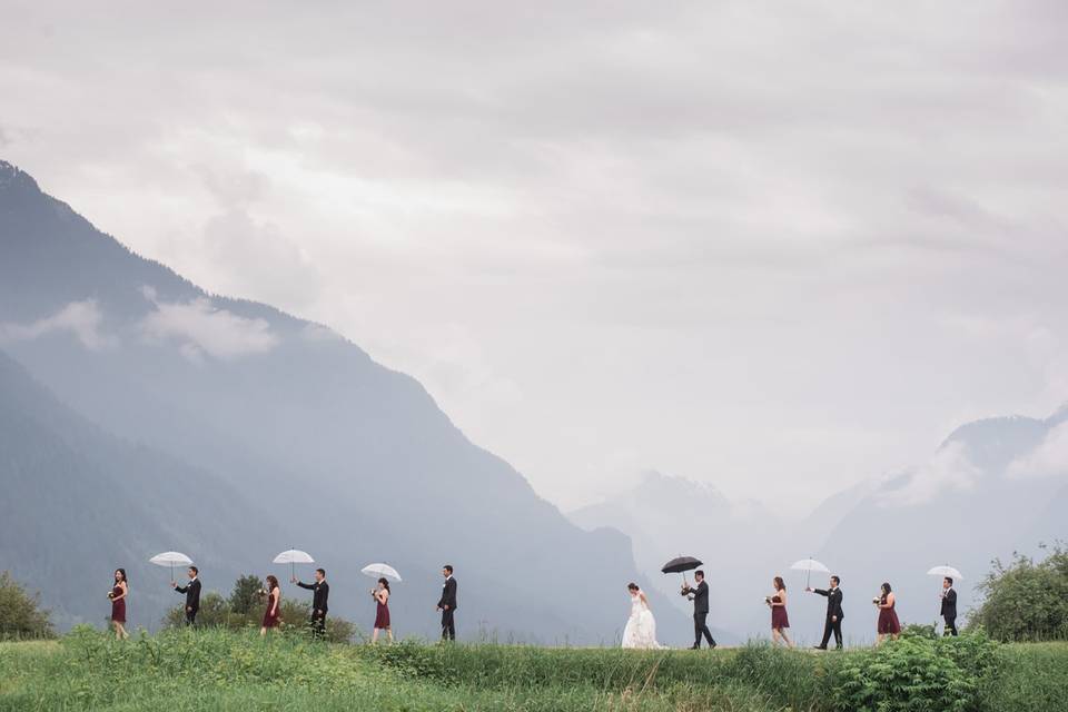 Wedding party walking in rain