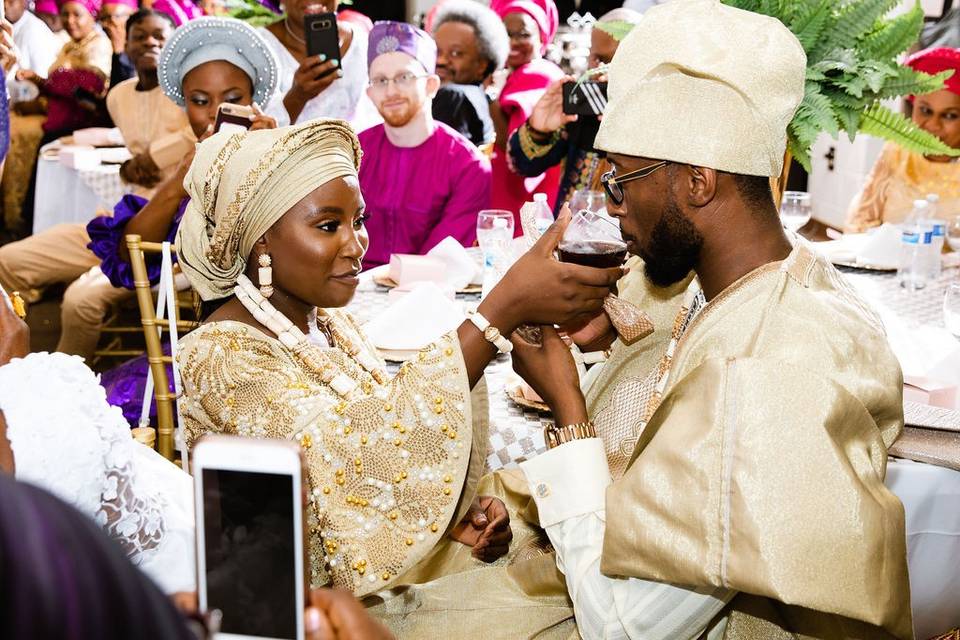 Groom drinks from bride