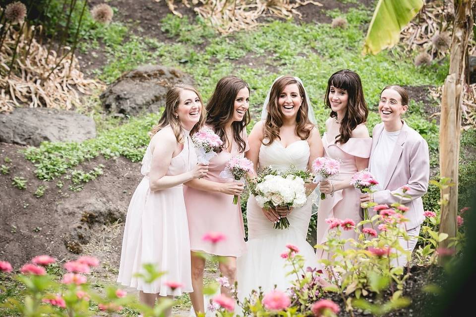 Bridesmaids with pink gerbera