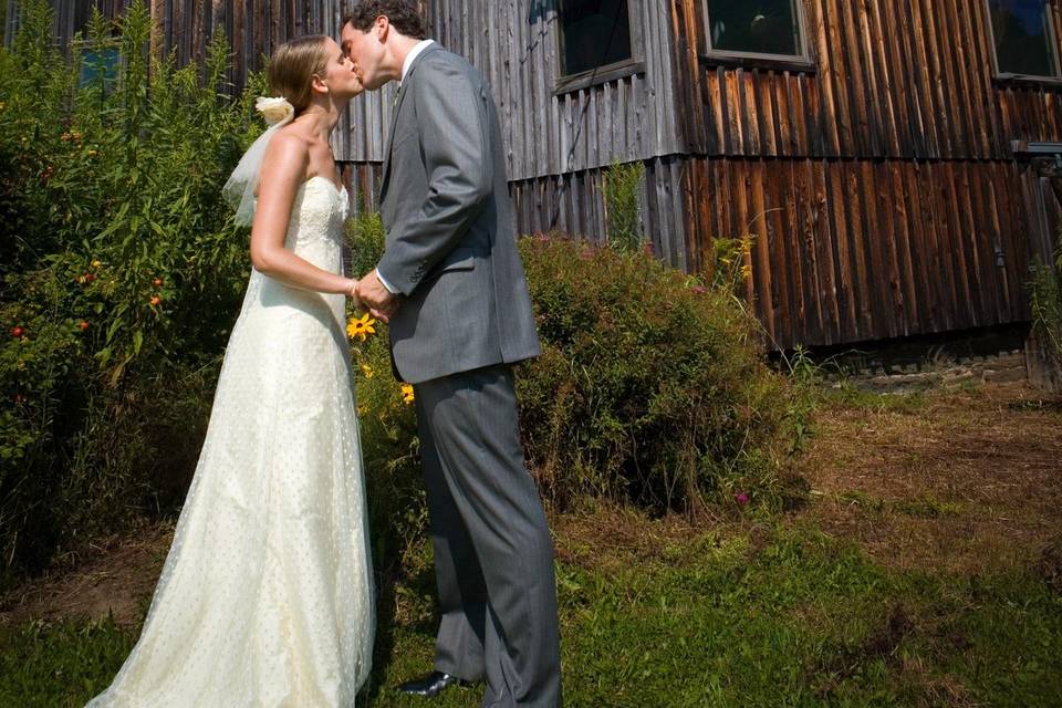 Bride and groom embrace in fro