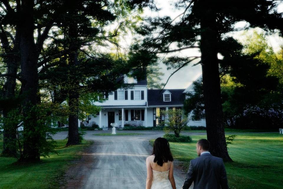 Bride and groom walk hand-in-h