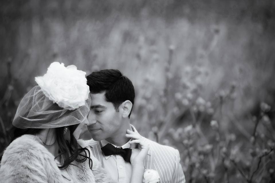 Bridal couple closeup in grass