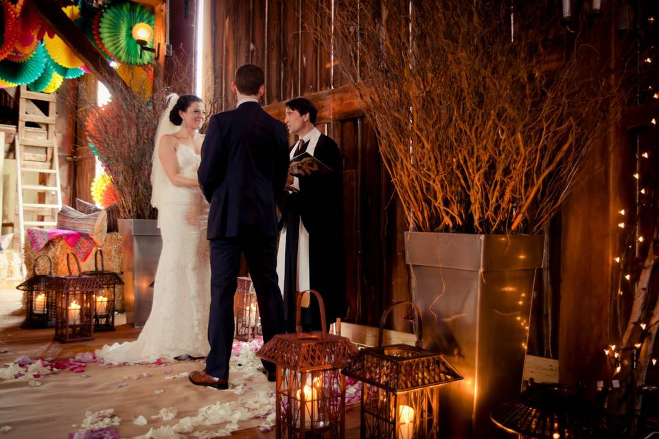 Barn wedding ceremony lit by w