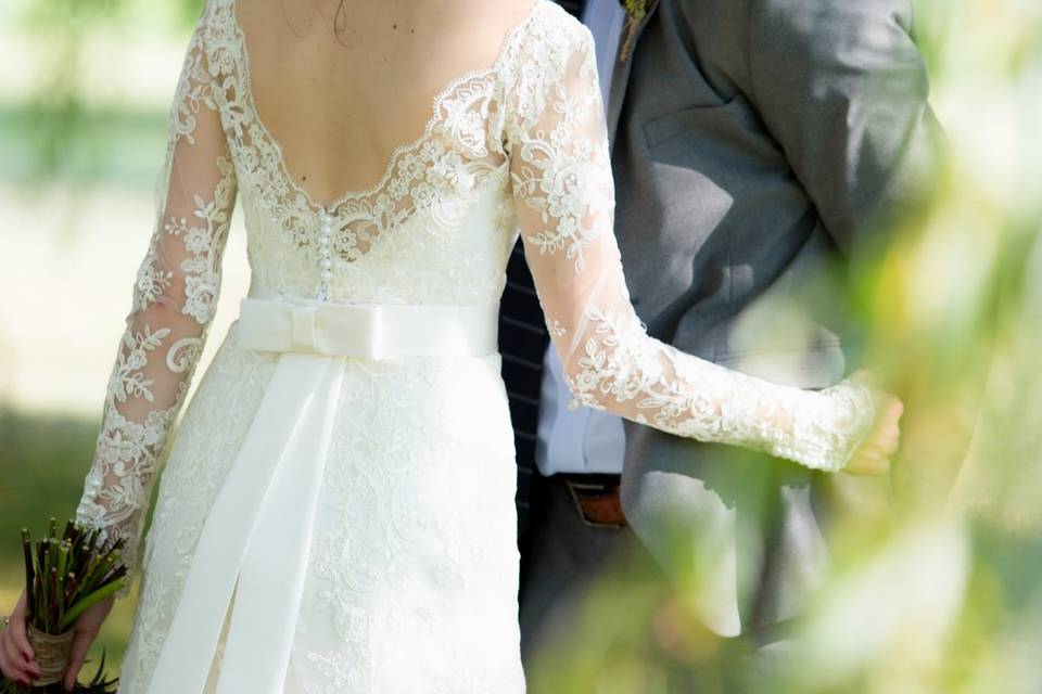 Wedding couple under sun-dappl