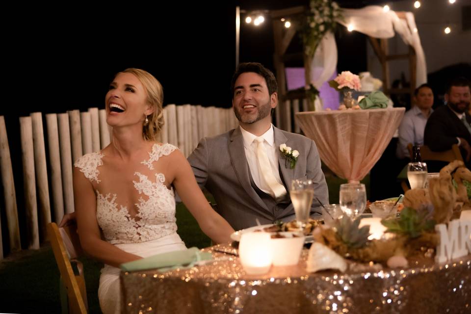 Bridal couple laughter during