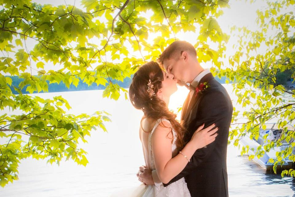 Bride and groom embrace on Mus