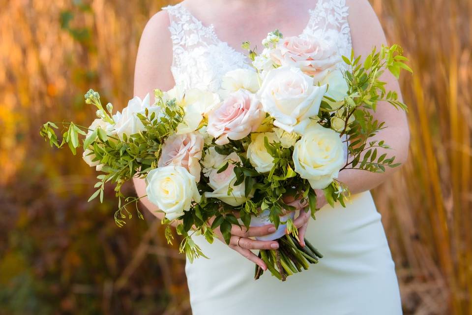 Bride backlit by fall colours
