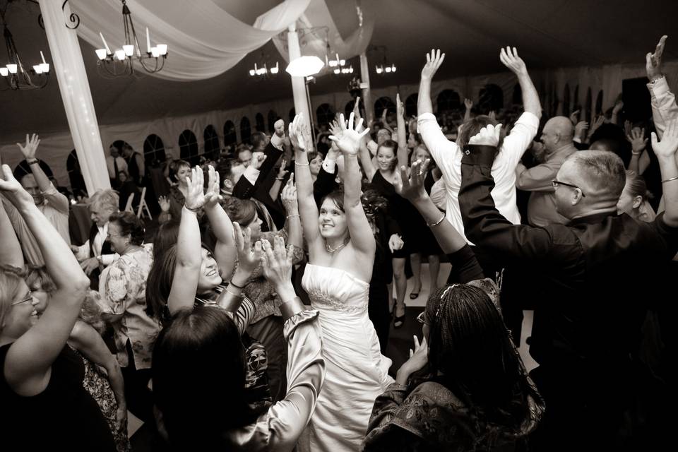 Bride is surrounded by guests