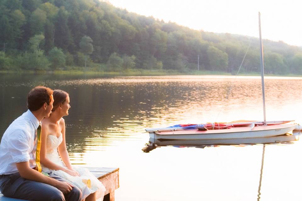 Bride and groom relax on lakes