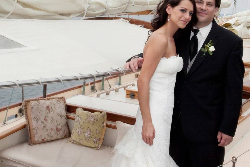 Bride and groom on sailboat at