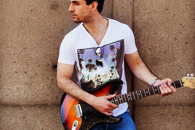 With his guitar