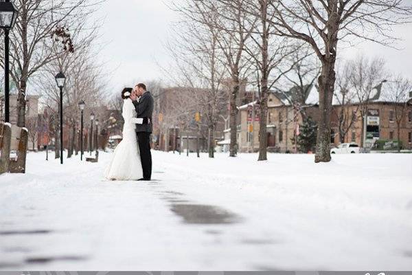 Wedding Photo? bride and groom kissing along a snowy path.jpeg