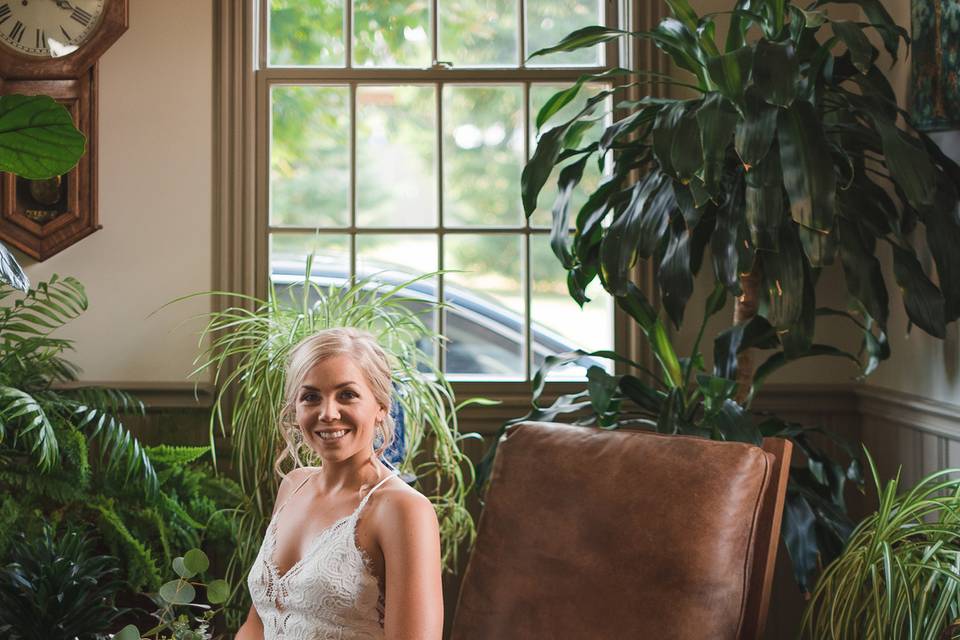 Bride surrounded by plants