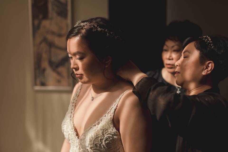 Bride getting jewellery on