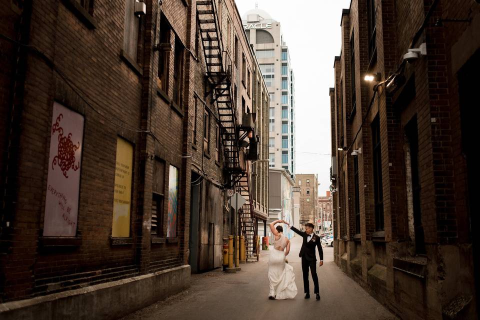 Couple dances downtown alley