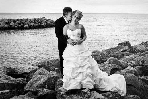 bride-and-Groom-standing-on-rock-pier.jpg