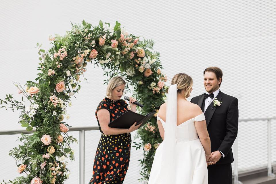 Beside the floral arch