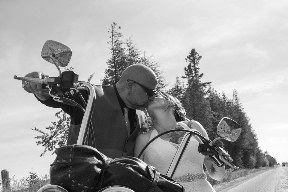 Wedding kiss on motorcycle