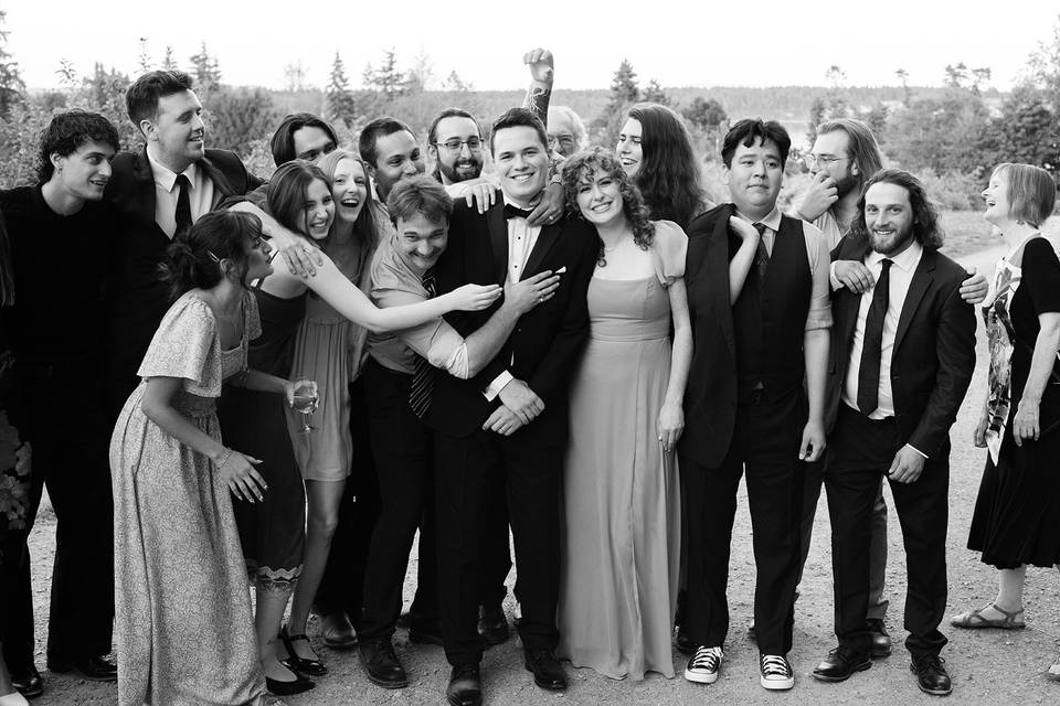 Groom surrounded by friends