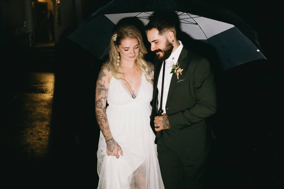 Bride and groom in the rain
