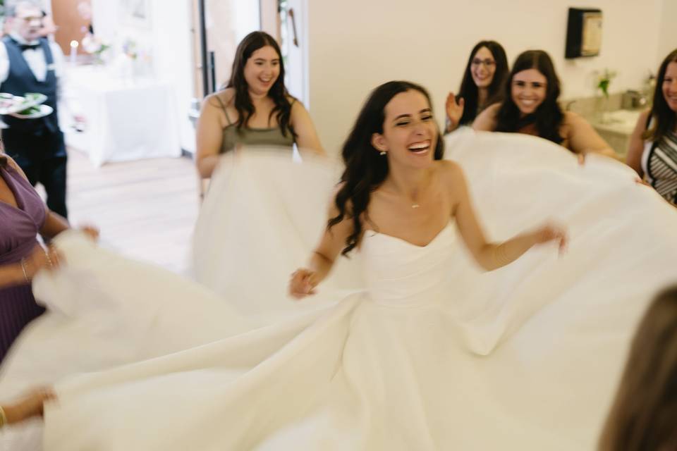 Bride dancing with friends