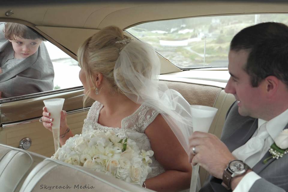 Bride and groom in car