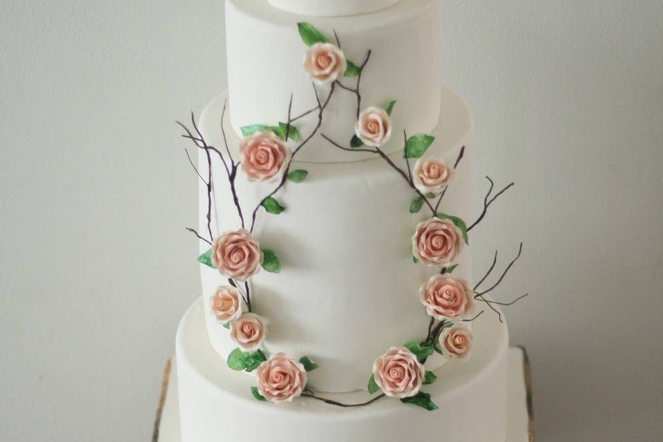 Box base cake with floral wrea